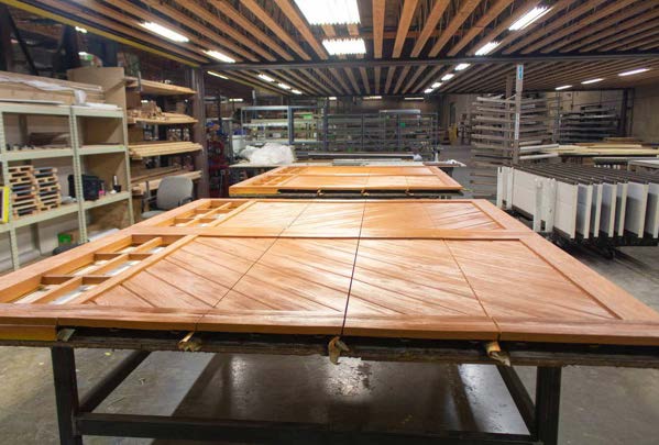 Doors in progress on workshop benches
